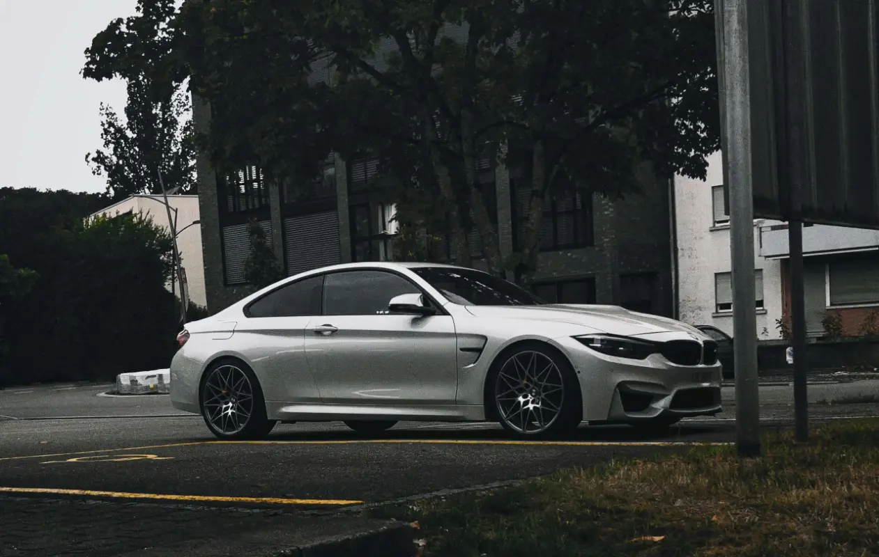 Silver BMW luxury coupe parked on a street in Belgrade. Example of a car for Hourly Chauffeur Service in Belgrade.