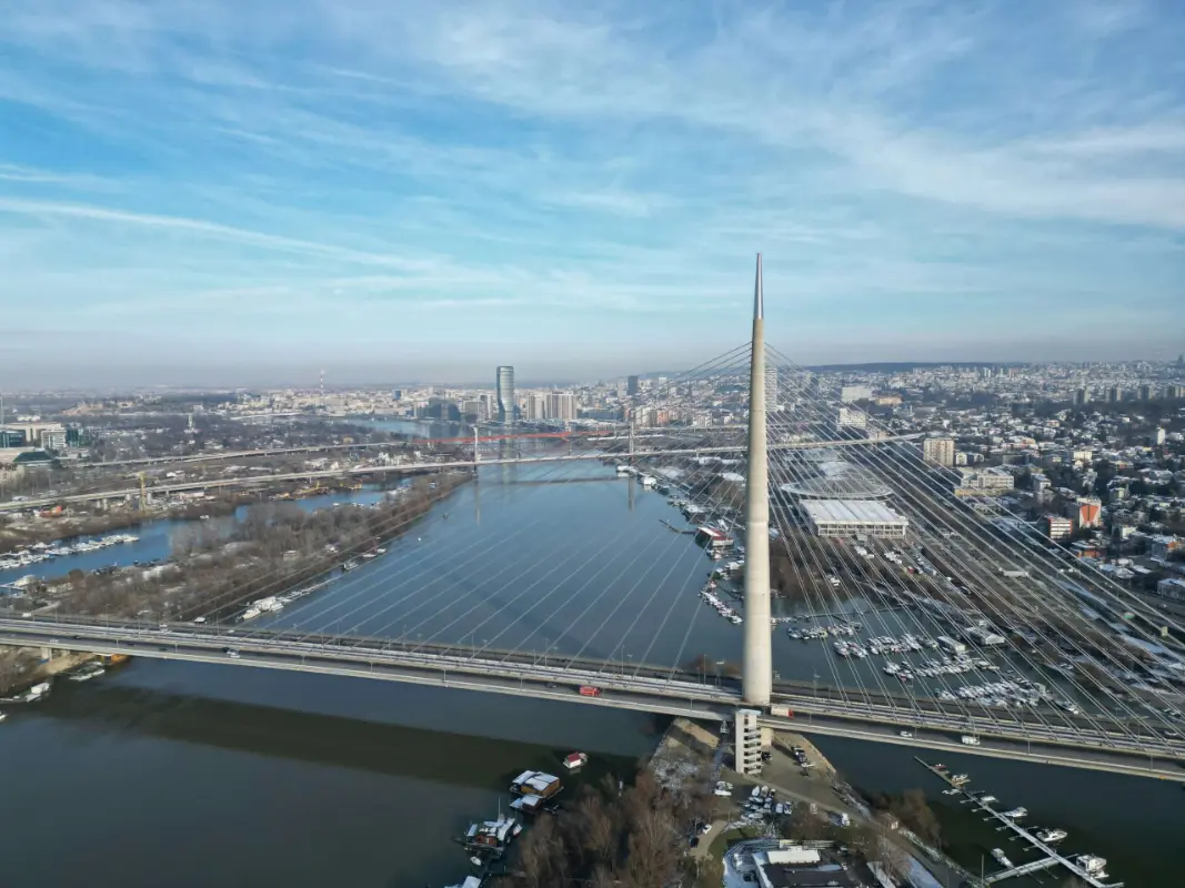 Aerial view of the Ada Bridge (Most na Adi) in Belgrade crossing the Sava River during the day. Example of Belgrade City ride service.